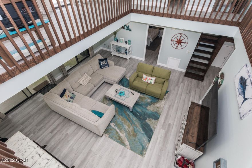 RAISE YOUR HAND if you dream of owning a BEAUTIFUL spacious home on the west side of PCB, & short distance from the beach!!  Not only does this home have 2356sq. ft., but most of the furniture will remain!  It also boasts a big back yard where you could build a pool if you desire. Let's talk UPGRADES!!  These include but not limited to; Flooring throughout home, granite counter tops in kitchen & new cabinets, paint & trim throughout house, New doors & door handles, New walk-in Master closet and a HUGE gorgeous walk-in shower, metal roof in 2019, just to name a few, There is NO HOA!  Long term rentals (6mo. min.).  This is a MUST SEE!!!