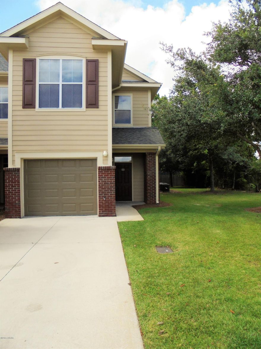 MUCH SOUGHT AFTER END UNIT...This 3/2.5 townhome offers an open living room/kitchen, hardwood floors downstairs, 9' ceilings throughout, spacious floor plan, screened in back porch, and large walk-in closets. The kitchen features black appliances and black tile granite. The master bath has a double vanity sink and large walk in closet; with a separate laundry room, nearby, 2 bedrooms and a full bath complete the upstairs. There is a large one-car garage for parking. All this and in a gated community, close to the mall, restaurants, theaters and hospitals. The complex has a large club house and a pool! Please verify all measurements for accuracy. HOA fee includes garbage, lawn maintenance, pool, club house, accounting, and common area.