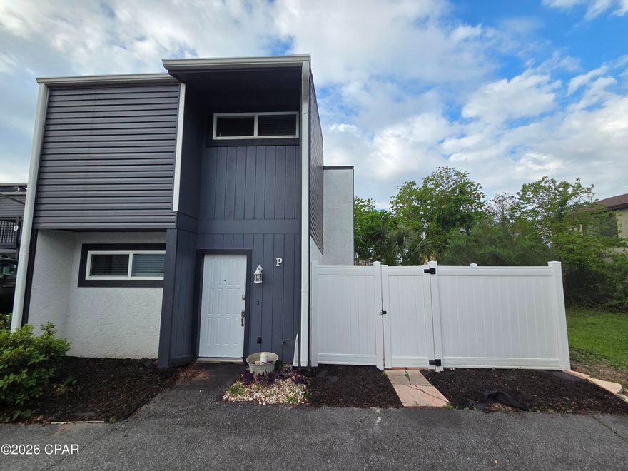 Welcome to this beautifully renovated townhome near Grand Lagoon in Panama City Beach--where comfort, style, and convenience come together.

This 2-bedroom, 2.5-bath home has been thoughtfully updated with modern finishes throughout. The kitchen features a breakfast bar perfect for casual dining, while the open living space is enhanced with ceiling fans and abundant natural light. Upstairs, both bedrooms offer privacy and en-suite bathrooms, including a stunning primary suite with an oversized, spa-like shower featuring luxury tile and a private balcony for enjoying the coastal breeze.

Step outside to your fully fenced backyard and partially covered patio--ideal for relaxing or entertaining. Just steps from your front door, you'll find the community pool, fully maintained for easy enjoyment year-round. Two dedicated parking spaces directly in front of the home add everyday convenience.

With its fresh renovations, desirable layout, and unbeatable proximity to Grand Lagoon, this townhome offers an inviting coastal lifestyle in a well-maintained community.

------------------------------------------------------------------------------

*Water/Sewer, Garbage, Pest Control & Lawncare Included!*

*Washing Machine Available 'As-Is' for Convenience!*

*NO PETS*