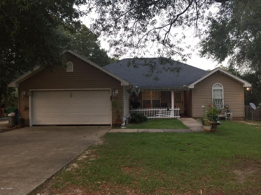 This 3 bedroom, 2 bathroom home offers a split bedroom plan, fenced back yard, screened in back porch, covered front porch and plenty of oak trees for shade. There is a 2-gar garage and plenty of parking in the drive way and beside the house. The master bedroom has a walk-in closet inside the master bathroom that has double vanities in a split bedroom plan. The kitchen has a stainless steel refrigerator and electric stove, pretty dark cabinets with adjustable shelves, and recessed lighting. The breakfast bar counter is also used for food prep. Located not far from the Sunny Hills Library, it is near outdoor activities like boating and swimming at Boat Lake. Another main attraction is the popular Sunny Hills Golf Club for all skill levels.