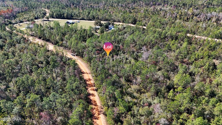 You'll love this peaceful 1+ acre lot located in Compass Lake in the Hills. Perfect for building your new single-family home or placing a manufactured home, this beautiful property sits within a 10,000-acre community positioned ideally between Dothan, AL and Panama City Beach, FL. The neighborhood features two gorgeous lakes and a wide range of amenities. HOA membership is voluntary for $135 annually and includes access to lakeside beaches, swimming pool, canoe/kayak/fishing boat rentals, boat launch, pavilion/clubhouse rentals, fishing, boating (electric motors allowed), golf driving range, and disc golf. The community also offers an onsite restaurant, Olle's, known throughout the area for its fantastic German cuisine. All measurements are approximate; buyer to verify via survey.