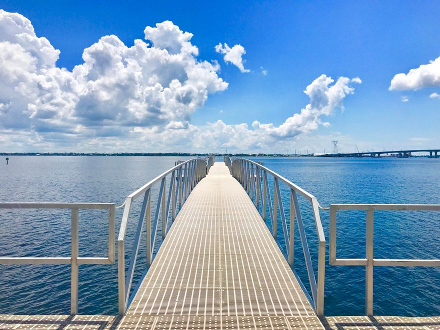 CURRENTLY UNDER CONTRACT, SELLER ACCEPTING BACKUP OFFERS. CUSTOM WATERFRONT HOME AWAY FROM HOME. Pictures do not do this unit justice. Balcony sits at the Southern most end of the building, offering the most incredible views of the bay. This unit boasts countless upgrades including custom cabinets, granite, high end appliances & custom coffee station including tv, water dispenser & built in beverage refrigerator.  Custom window treatments throughout, to include black out curtains & custom solar shades. Hardwood flooring adds elegance throughout the entry, kitchen, dining&living area. Wood plank tile in the master bath leads to the custom designed vanity, shower & HUGE closet. Plenty of storage. This unit hasn't been used as a rental & is in excellent condition. It's a must see! Fully furni a perfect layout for entertaining. At over 2000 square feet, with 3 large bedrooms and 3 bathrooms.  Many full time residents.  Welcome to a community with many activities.  Water aerobics, ladies night on Wednesdays, men's poker night, crab boils and live music by the pool, annual Halloween party, and many more fun activities available.  A wonderful gated community set away from the traffic and chaos, HIBISCUS BY THE BAY - a gorgeous pool, hot tub, owners lounge, 500 foot pier, waterfront marina, exercise room, and tennis courts.  Garage units and boats slips are available for sale.  *All information should be verified by buyer if important.