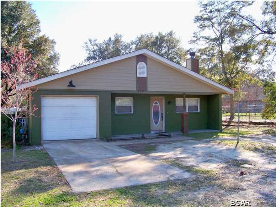 Imagine owning a home within walking distance to the Bay and to the Heart of St. Andrews where you could enjoy dining, shopping, entertainment, weekly Farmers' Market and annual Mardi Gras festivities just to name a few. Well, your time has come. This adorable home is perfect for either a first time buyer or maybe a second home. Along with its white picket fence, it has been upgraded with features such as hard wood floors, bead board, chair rail moulding, two fireplaces - one in the living room and one in the master bedroom - intricate tile work in both bathrooms and the kitchen. The kitchen has tile back splash, breakfast bar, and lighted cabinets. Storage is not a problem. Not only does each bedroom have a spacious closet, there is a pantry, a one car garage with a storage room and