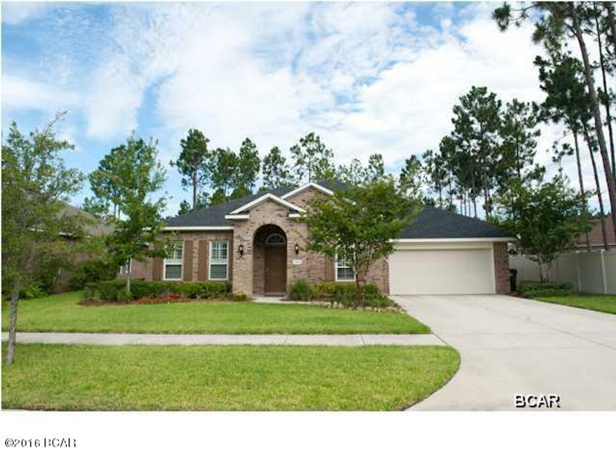 Remarkable home in like new condition! Owners have taken superb care of this fabulous 4 bedroom, 3 bath home that also has a separate study. If you are needing a home with a lot of space this is it! Home has many upgrades to include: HUGE California Walk-In Closet in Master, 16'' upgraded tile with inlay, hardwood floor in formal dining, granite on kitchen countertops, center island(breakfast bar) and on serving bar separating breakfast area and family room. Kitchen and bath cabinets are glazed and look rich and beautiful. The oversized Master bath features his and her vanities, a deep soaker tub, a frameless glass shower, a linen closet and a water closet. Plantation shutters adorn the windows in the study and also the front additional bedroom (which has a walk-in closet).  All windows are oversized, have a high wind rating and have cellular shades that let down from top or up from bottom. Enter the study through beautiful French doors. Judges panels, w/chair rail, dress up the walls around the entire room. Home also features wall speaker cabling and additional network cables through all rooms. Back lanai has been screened-in and also features a nice size storage building that is large enough to house yard equipment. There is a lawn sprinkler system that is unmetered using reclaimed water (that means it is FREE!). Keep a beautiful lawn all summer long and it won't cost you a fortune! You are just minutes from shopping & some of Bay County's best schools. All sizes and measurements are approx.