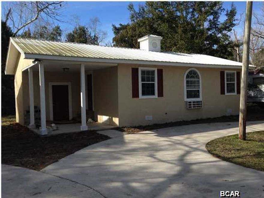 This charming 2 bedroom, 1 bath home is newly renovated inside & out. Open floor plan with spacious living room. Interior & exterior newly painted, upgraded lighting fixtures, new ceiling fans, all new carpet in the living room & bedrooms, beautiful new laminate plank wood flooring installed in the entry way, kitchen/dining area, hall & bathrooms. The kitchen has plenty of storage for all of your kitchen items and has a new refrigerator & stove/oven. This home has a separately enclosed laundry room with easy access from the front patio. Circle driveway, wall heat/air, nice yard space. Some pets are negotiable with a non-refundable $150 per animal fee. Pets must be 25lbs or less.