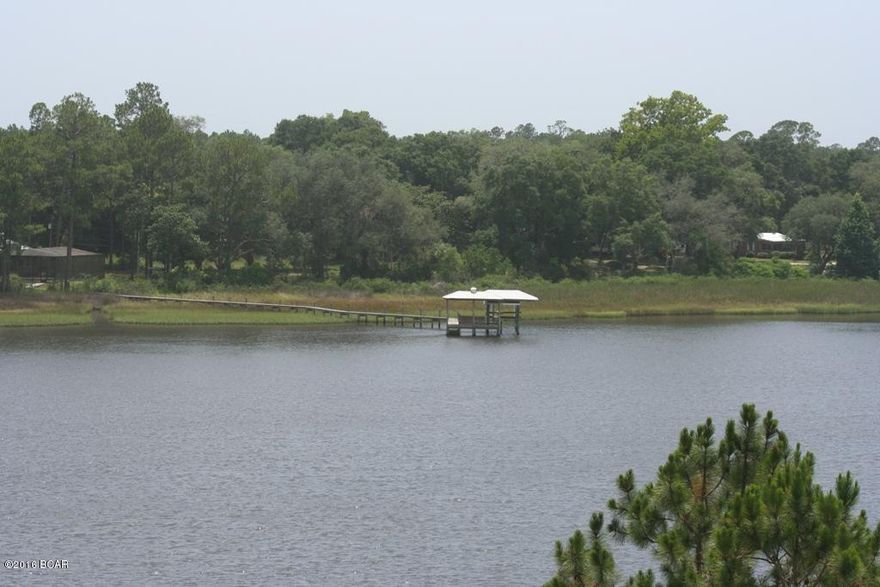 This is Parcel B We have a survey and a riparian survey showing your water rights out into the water for docking permit purposes availability.
Directly overlooking Intercoastal Waterway and across from the new Margaritaville Latitudes Development. There are Plans for a Marina and waterfront restaurant across the Intercoastal.  Premier spot for a nice waterfront home or a high-end townhome. With lots of pretty waterfront frontage. This lot is towards the end of the road for lots of privacy.