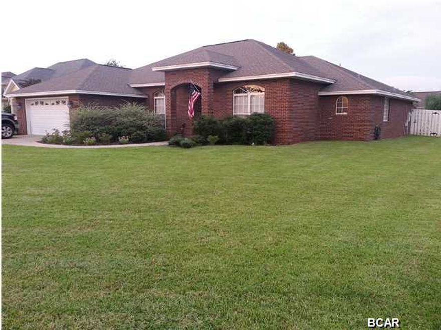 WONDERFUL CUSTOM BUILT HAMMOCKS HOME! This 4 bedroom/ 2 bath all BRICK open floor plan home on a CORNER LOT and in an A rated school district has everything you need. It is centrally located to TAFB and shopping/restaurants. This home has all of the extras such as wide crown molding, 10' ceilings, trayed ceilings, stained concrete floors, fireplace, solid oak cabinets, stainless appliances, double vanity in the master bathroom, separate shower, jetted tub, solid surface countertops, formal dining room, French doors overlooking the covered patio, pull down stairs for attic, sprinkler system, transferable termite bond, privacy fenced backyard, Florida Pest Control lawn service contract and surround sound wiring. A BONUS is that The Hammocks has a COMMUNITY POOL and GAZEBO for