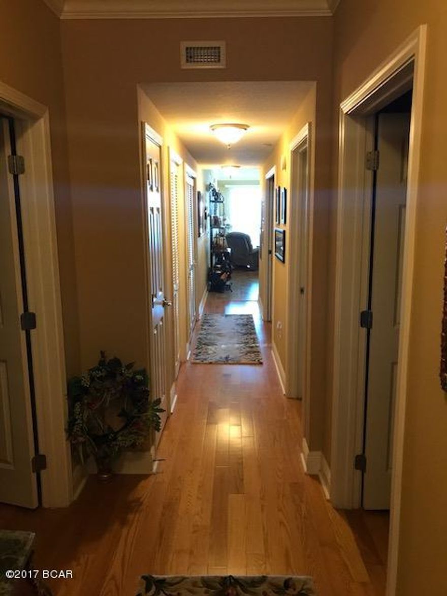 Incredible views from this 5th floor unit at Magnolia Bay Club.  This unit is a 3 bedroom (with an office/den) and 3 full bathrooms over looking beautiful St. Andrews Bay.  This unit features wood floors throughout, tile in the wet areas, granite counter tops, master bedroom overlooking the water with access to the balcony.  The master bathroom has a separate tub and shower with a double vanity.