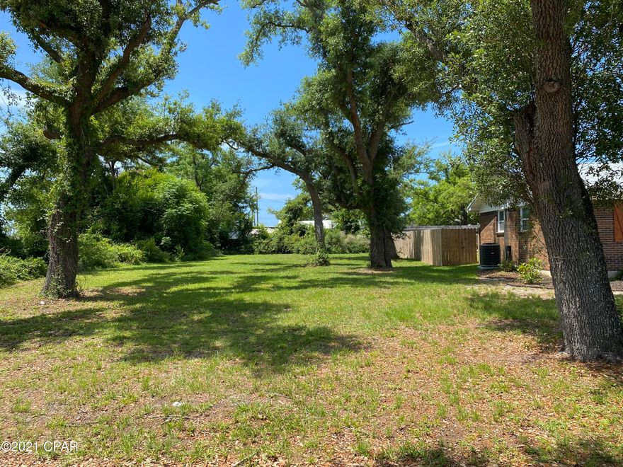 Very nice building lot in residential area near Tyndall, Parks, restaurants, and shopping.  Located directly off Tyndall Parkway.  Boat launch less that a block away.  Perfect for a single family home, or check with the City of Parker and possibly build a duplex like the one across the road.  

Water and Sewer is available for the property.  Water tap in fee $640.00; Sewer tap in fee $500.00; Water impact fee $500.00; and sewer impact fee $1400.00.

Take a close look at this lot!