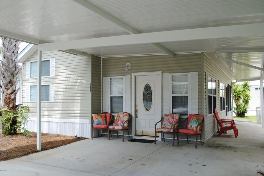 IMPROVED PRICE... This home is a must see! Located in Emerald Pointe Resort, the home features an open floor plan with a large living area, 2 bedrooms, 2 bathrooms plus a bonus room that is currently set up as a third bedroom. Bonus room can also be used as a Florida room. Pictures are prior to tenant. Ask your agent for details. Emerald Pointe is a gated community that offers a large clubhouse, exercise room, 2 pools (one heated seasonally), hot tub, lake with boardwalk and a  shuffleboard court. HOA includes: water, sewer, garbage, cable, and lawn service. All information is approximate and should be verified by buyer if important.