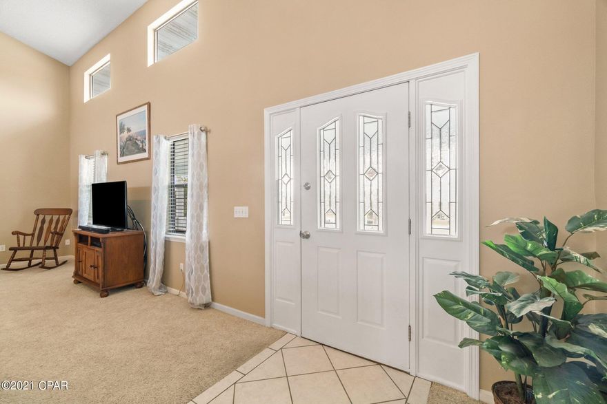 Enjoy beautiful sunsets from your front porch in the quiet neighborhood off North Lagoon Drive, yet only a 5-min drive from Beach Access 23. This 4-bedroom 3-bath home sits on a large lot on a dead-end street and offers 2 suites, one on the first floor and a second on the top floor, along with the additional 2 bedrooms, a full-size bathroom, and a spacious dining room next to the kitchen. The large living room on the middle floor has open views to the dining and kitchen area, a cozy fireplace for the winter days, and windows to the covered front porch. The first floor accommodates a large Game room with additional fireplace, wet bar, and access to the large fenced-in backyard, which has plenty of space for an in-ground pool. The deep oversized 2-car garage easily fits a full-size truck, has plenty of storage, with access to a unique and additional storage space just under the living room. This home is very energy-efficient with the current owner seeing summer electricity bills at $101 or less. Roof is less than 3 years old and a New energy-efficient Air Conditioning System was installed in August 2021.
 All measurements are deemed correct, buyers should verify if they are important