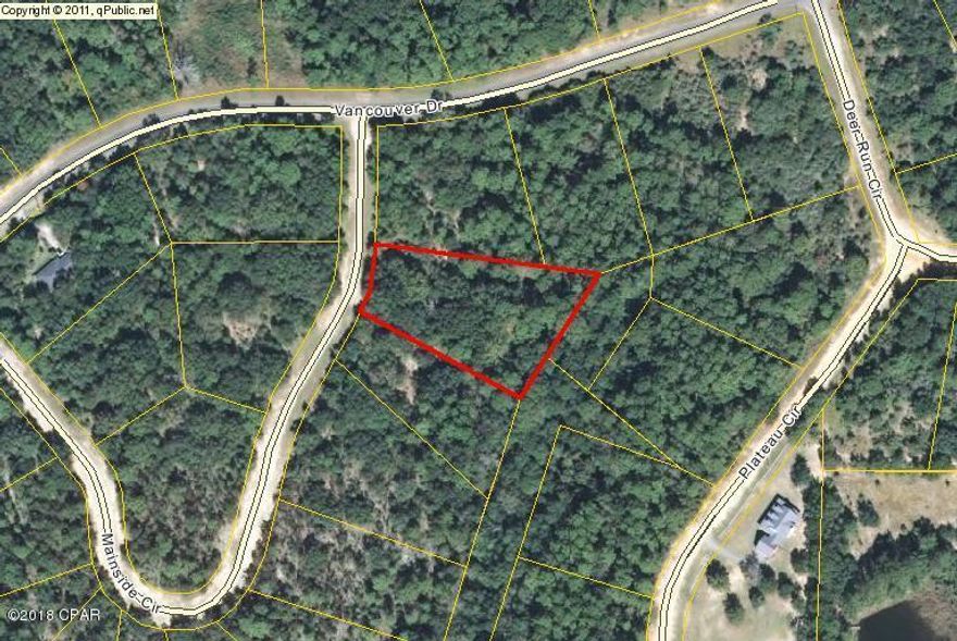 Vacant wooded land in Compass Lake in the Hills, nice wooded lot.