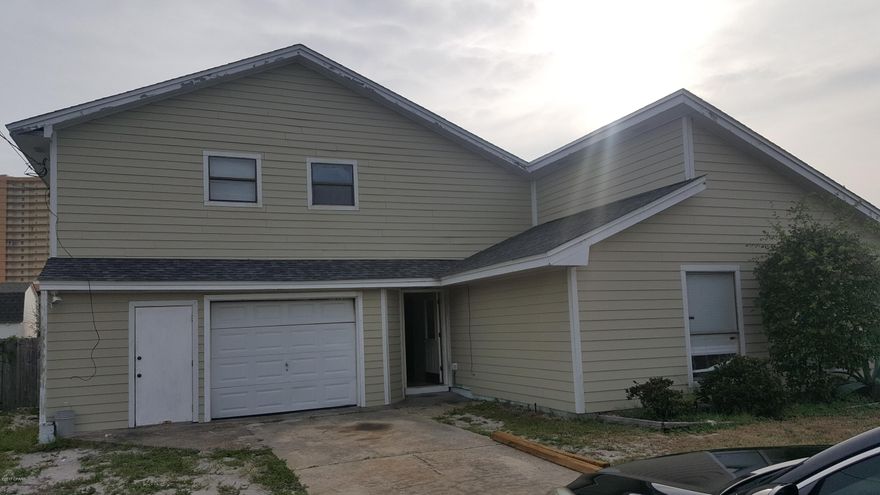 WALKING DISTANCE TO THE GULF OF MEXICO!!  2 Story home located at the east end of Panama City Beach. Downstairs has a large and open living area/dining/kitchen combo with an added den on the back, 2 bedrooms and a bathroom. Upstairs is the master bedroom that opens to a large balcony to enjoy your Panama City Beach Views and relax. Home features a fenced back yard and patio area. Thank you for considering this home and all measurements and information should be verified if important.