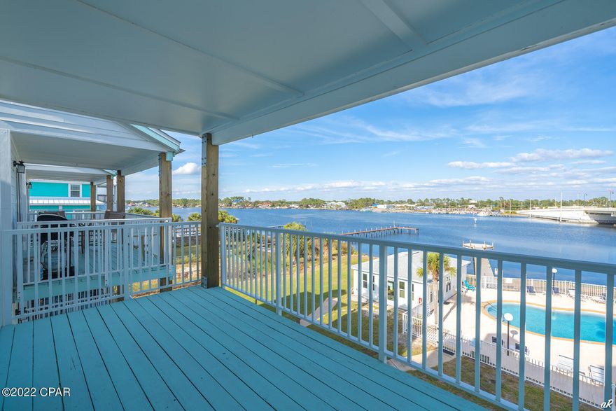 Beautifully furnished and updated condo for rent monthly through May 2022. All utilities included! Enjoy the balcony waterfront views overlooking Grand Lagoon. This is a spacious one bedroom, one bath unit with bonus loft upstairs. The master bedroom has a king bedroom suite with flat screen TV & ample closet space. Bathroom has a tub/shower combination and is completely updated. Entering the kitchen you'll find an open concept to the living room and water views. The kitchen boasts granite counters, new cabinetry and stainless appliances. This is a comfy, cozy condo in the heart of Panama City Beach close to the Navy Base, grocery stores, and local favorite restaurants. Treasure Cove Condos is a quaint waterfront community with a pool and boat dock.