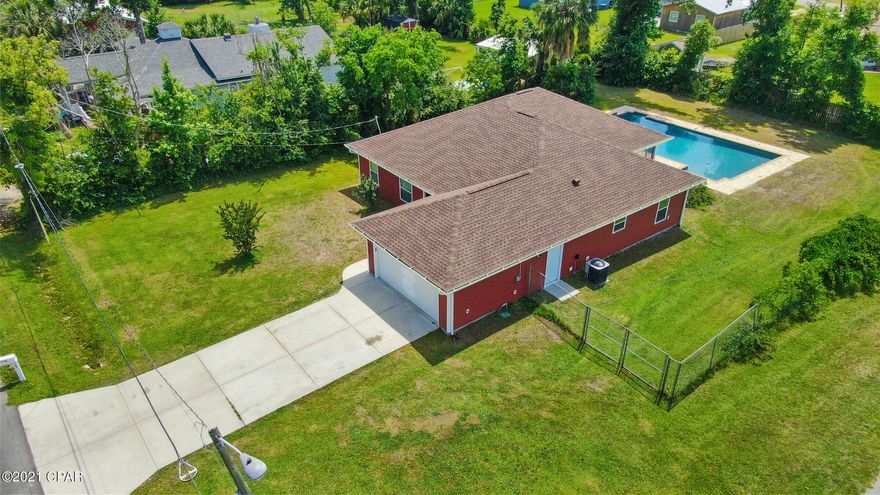 CURRENTLY UNDER CONTRACT, SELLER ACCEPTING BACKUP OFFERS This is not a drive by!!! Come and check out your new home! This lovely Lynn Haven gem is just a few blocks from Leslie Porter Wayside Park and the boat ramp at the Bailey Bridge.  This fantastic custom built home was built in 2014 and has a great open floor plan with nice kitchen, oversized closed storage pantry off the laundry room, 3 roomy bedrooms - the owner's suite has an extra ''bump out'' sitting area and a large walk in closet.  And wait... There's more.... The largest residential pool you will ever see!!! It's huge! 20x40 with water feature and paver surround!! Large double corner lot with full irrigation system.  Also has professionally installed RV electrical hook-up on the side of the house! If you're looking for a pool