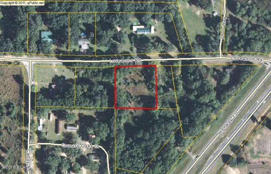 Vacant wooded lot on paved road, just needs some clearing, very nice lot for building or a mobile home.