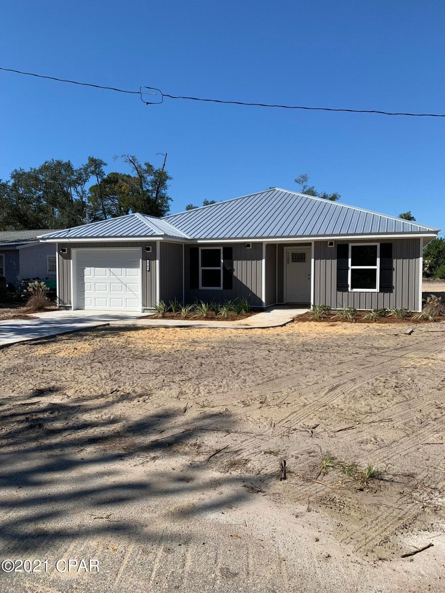 ST ANDREW'S , NEW CONSTRUCTION! This 3/2 features loads of CRAFTSMAN STYLE CHARM and is located in a great neighborhood close to all area  amenities; ST ANDREW MARINA, restaurants, GULF COAST STATE COLLEGE, FSU and a just a quick trip to the beaches. On the inside is an OPEN FLOOR PLAN that includes a spacious kitchen offering BEAUTIFUL QUARTZ COUNTER TOPS, STAINLESS APPLIANCES and WHITE SHAKER STYLE CABINETRY. The living area has a coffered ceiling and a great view of the back yard. The dining space includes an over sized breakfast bar and room for a large table. The master bedroom is tucked into a private corner and has walk in closet and a bath with double vanity. The outside features a metal roof, open porch, garage and privacy fenced yard. Hard to find all this at an affordable price!