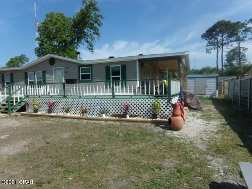 'CURRENTLY UNDER CONTRACT, SELLER ACCEPTING BACKUP OFFERS'-Great opportunity to buy an affordable home in Panama City Beach! Move-in ready double wide mobile home on a nice lot with large storage buildings. Located between North Lagoon and Front Beach Rd off Laurie, convenient to shopping, restaurants, schools and beach. Split-bedroom floor plan has3 bedrooms, 2 baths, large kitchen dining area and 8' by 30' covered porch in front, wood-burning fireplace in living room and a garden tub in master bath. This would make a nice affordable home or a rental property. Zoned R-2 for mobile home, single family residence or duplex. All info taken from appraiser site and sizes approx., please verify.