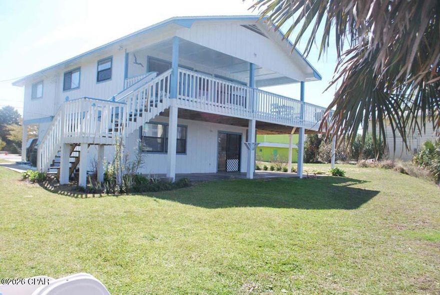 Beautiful Lakefront Family Home-Duplex only steps away from Florida's Beautiful Beaches. 3 bedroom/ 1 bathroom upstairs home in a family neighborhood located directly across the street from the beach with public access! Relax on our covered or uncovered deck to soak up sun or cool off in the shade. Located only 5 miles from shopping, restaurants, movie theaters at the newly built Pier Park! Double carports. King size bed with pull out single bed in Master, Queen size bed with additional twin bed. Full size bunk beds.

Located directly across the street from Laguna Beach. Beautiful family beach. Only 5 miles from great shopping, restaurants at Pier Park! Only 1 mile from Thomas' Donuts! Relax on the deck watching the sunset over the beach in our great 3 bedroom Duplex Home.