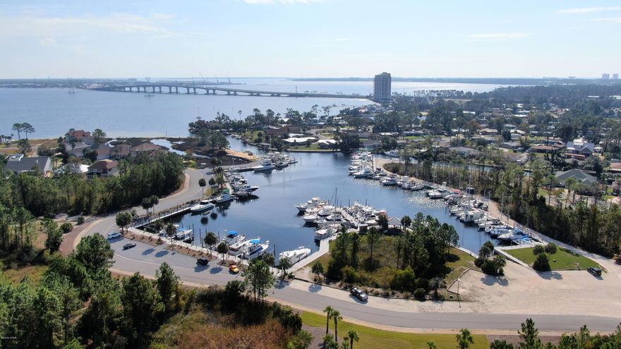 THIS IS AN EXCEPTIONALLY NICE – THREE BEDROOMS / TWO BATH HOME!  VACANT AND AWAITING THE NEW OWNERS! ... 

Located within the highly desirable GATED, WATERFRONT, MARINA community of Dolphin Bay on Panama City Beach. This home is in beautiful condition with many ''post'' Michael updates, including a new roof, granite counter tops, fresh paint both interior and exterior, new carpet +++ please see the attached ''Updates List'' in the documents section.  The large back yard has adequate room for a large pool and pool cabana.  Beautiful crown molding and chair rail give the home a custom home accent throughout the main living area, kitchen and dining areas.  Continued ...

.. The over-sized master bedroom suite is comprised of a wonderful natural light bathroom area with both jacuzzi whirlpool tub and walk-in shower, large walk-in closet and adjoining room for office, nursery, library or other owners preference.
..
The open kitchen area has a breakfast bar, multiple cupboards, working counter top areas, pantry and abundant storage space.  An extension of the kitchen is a casual eat-in area, with a large bay window .  The Kitchen overlooks the cozy family room with gas fireplace, entertainment center, book shelves and double French Doors to the covered porch.  This porch area provides sun and weather protection and enhances the comfort/entertainment factor of the home.
..
There is a separate dining area for those desiring a more formal dining experience.
..
The additional two bedrooms and full bath provide private areas for children or guests.
..
The home has a private well for irrigation purposes.
..
THE AMENITIES AND LOCATION OF THIS HOME CANNOT BE OVER STATED - it affords its new owners a comfortable, functional split floor plan home with three bedrooms, two baths, covered sun porch, two car garage and multiple new updates within a gated, waterfront community with boat slips (to rent or purchase - with water & electricity) and a boat ramp providing both North Bay, Inter-coastal waterway and Gulf access!  Dolphin Bay is centrally located between the "Beach" and Panama City/Lynn Haven, with convenient access to the Navy base, beaches, schools, restaurants, shopping and entertainment venues.
..
All dimensions, square footage, age and measurements are approximate and if important should be verified by the buyer prior to purchase.