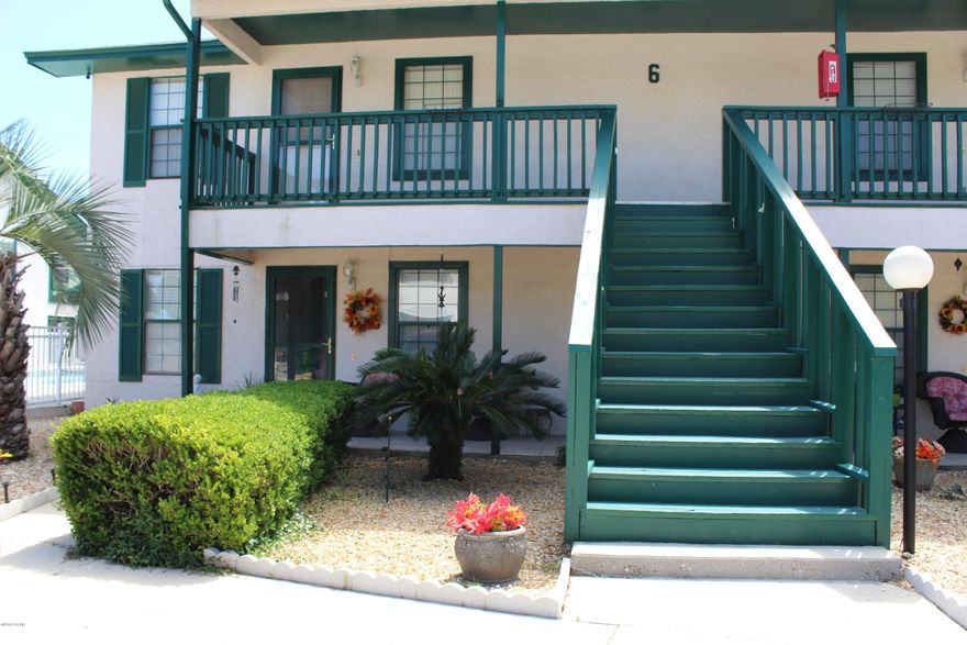 Just bring your toothbrush; this adorable two bedroom, two bath condo overlooking the pool comes fully furnished!  Split bedroom floor plan, plenty of storage areas, washer and dryer, a kitchen has a convenient pantry for groceries and an eat-in breakfast bar open to the dining/living area.  Both the master bedroom and the living area has access to the screened in balcony overlooking the pool.  Rental price includes water, sewer, and basic cable, grounds maintenance, as well as pool access.  There is also a community dock available on a first come, first serve basis.  Greenwood Estates is well kept, centrally located on the lagoon and is just 5 minutes to both the Navy Base and the World's Most Beautiful Beaches.  **NO PETS**