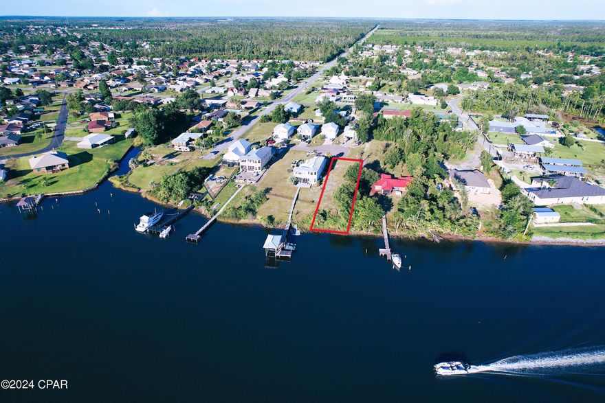 Seller is offering $4,000 toward Buyer's Closing Costs! 
Welcome to Emerald Coast Yacht Club community that offers  the ultimate boater's paradise! This west facing(gorgeous sunsets!) cleared, construction ready (flood zone X) waterfront property with deep water gulf access ( to give an idea - neighbors got 40ft aft cabin cruiser) is PERFECT for fishing adventures by day, and sunset cruises in the evenings. There is a conveniently located public boat ramp and park situated directly across the expansive bayou offering boat access and ample playground activities for the family. This exclusive development features a charming brick paver entrance that makes the block stand out, and is a premier location located conveniently close to shopping, dining, Tyndall AFB, and pristine beaches. There is no expensive/ restrictive HOA; however, homeowners adhere to simple rules to  ensure the subdivision remains exceptional! With only 3 vacant parcels remaining, this is the only waterfront lot available for purchase. Combined with relaxed building restrictions, this opportunity won't stay available for long! As an added value, when the original HOA covenants/restrictions expired, waterfront property owners were afforded the opportunity to annex the waterfront 'common' properties, adding useful building and storage space.

With continuously improving infrastructure in Bay County, waterfront properties become more and more desirable and there are only a hand full of gulf access lots available for purchase overall!