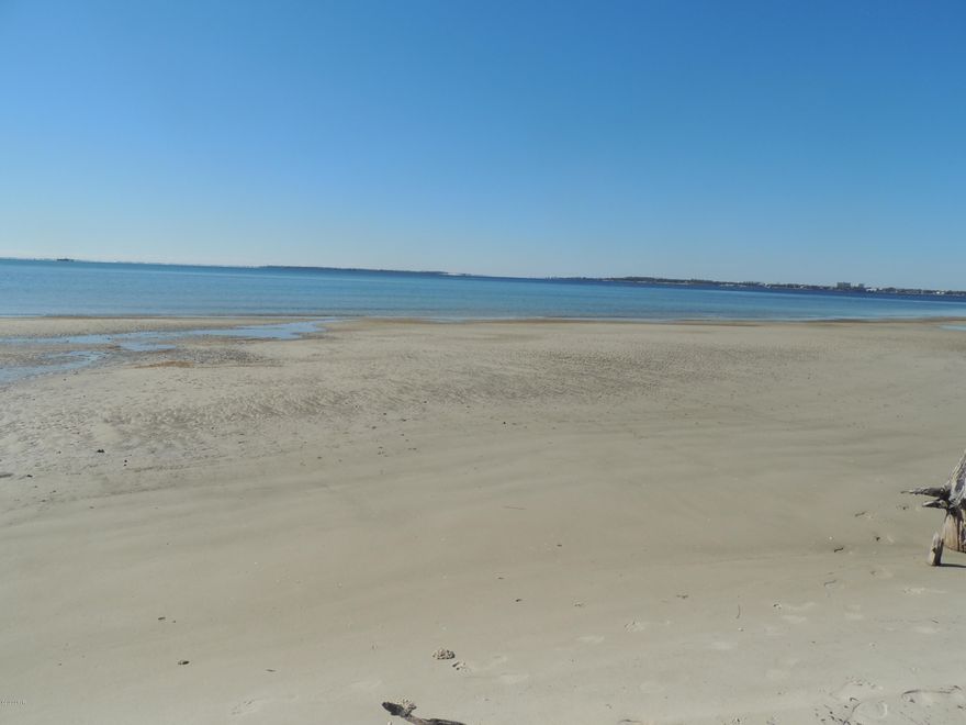 Wow!  Great opportunity to own approximate 150 feet on beautiful West Beach Dr, one of Panama City's finest locations.  These three lots have riparian rights.  Lot size is approximate, best to determine by having a survey.  Previous home on this location, had to be removed from extensive damage from Hurricane Michael.  Utilities should be readily available for new connection.