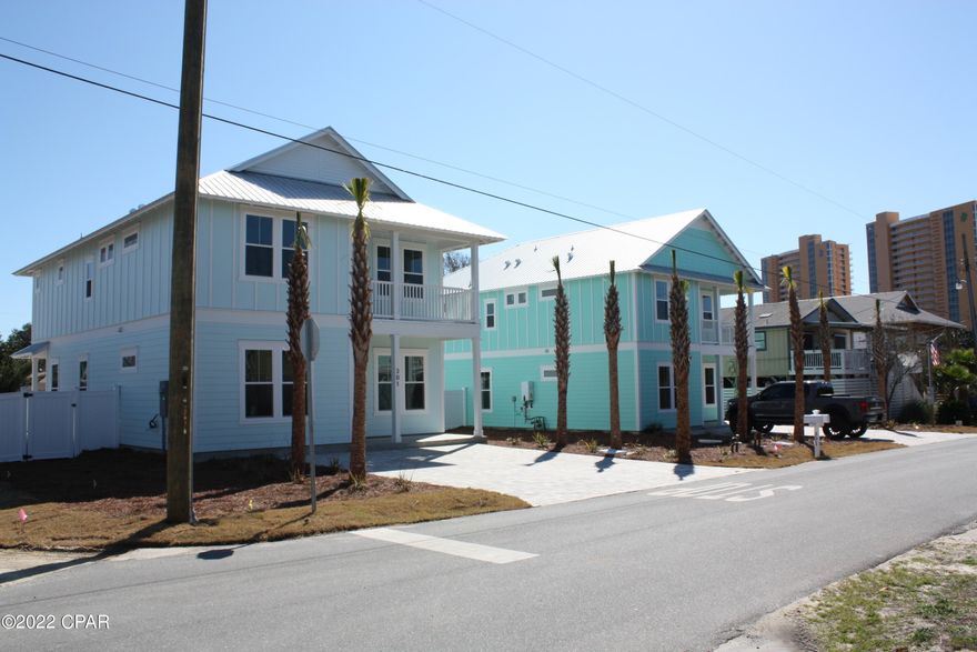 Beautiful New Construction Beach Home,  located on the much desired West End area of Laguna Beach. The Homes are situated just steps to the white sand beaches and are zoned for Short Term Rental, making this a wonderful investment. Included in the price   a 12x24 pool with pavers around the pool . 

 There is also an 18x7' covered patio that over looks the gorgeous pool area. This coastal home features a metal roof, hardie board siding, hurricane proof (high impact) windows, Double eight foot french doors, paver driveway, outdoor shower, and a tankless gas hot water heater.  Interior amenities include a gourmet kitchen with 42'' white cabinets with quartz counter tops, gas oven/cook top and walk -in pantry. There are six spacious bedrooms and four full baths plus a half bath. Two bedrooms located on the first floor and four bedrooms on the second floor. Enjoy the spacious media room also on the second floor. Conveniently located to shopping and Pier Park as well as restaurants and food stores .
