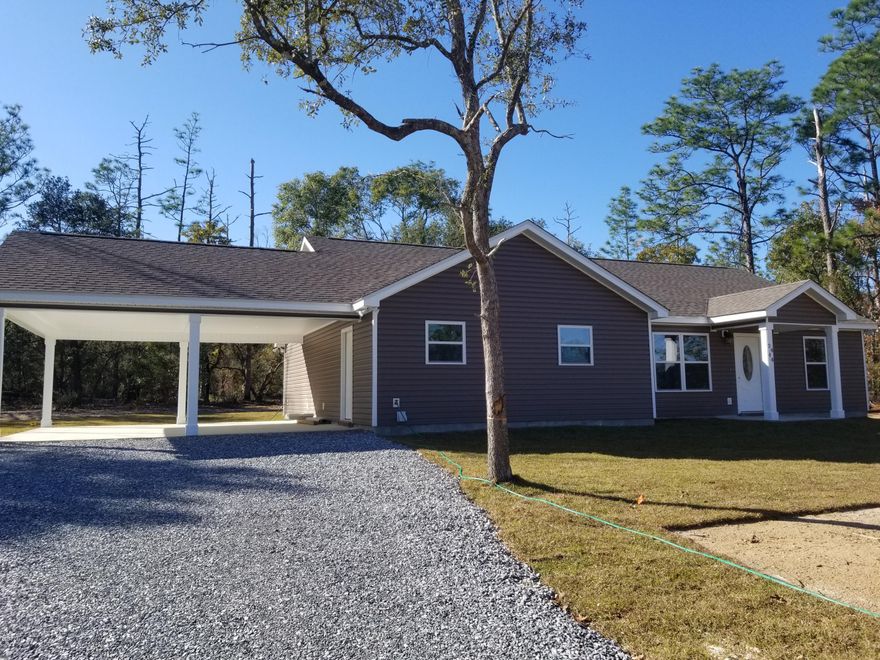Construction of this new home has just been completed as the builder received the certificate of occupancy on November 26. It is located in Leisure Lakes, a security gated subdivision off Hwy 77, just north of Hwy 20. It is about 25 minutes from Panama City. It is a 3 bedroom, 2 full bathroom home on a slab on a flat lot, no steps. It is a split bedroom design with a tall vaulted ceiling in the family room. It has self-closing cabinets, granite counter tops with a deep well sink and stainless steel appliances. It has a 2-car carport and a covered 10x20 concrete patio just off the family room. Subdivision amenities include 2 lakes, boat launches, basketball court, tennis court, toddler playground, grill stations, picnic tables, good for fishing, boating, swimming and more.