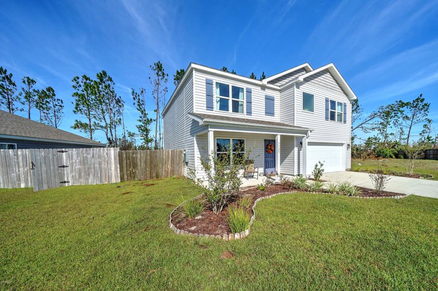 Gorgeous water view!  The Hayden plan features 5 bedrooms and 3 bathrooms. The home opens into a space that could function as a study or dining room. Down the hall is the open kitchen, living, and eating area great for entertaining. The kitchen has a large pantry, and large island overlooking the living room. Next to the living room, is a bedroom with a full bath next door. Upstairs is the master suite with a huge bedroom and bathroom with a double vanity, garden tub, separate shower, and huge walk in closet. There are 3 more bedrooms and a full bath upstairs along with a loft/den area and laundry room. Backyard over looks the lake.  Olde Towne Village is centrally located approx. 25 minutes from Tyndall. Age, Square Footage, lot and room sizes approximate, if important please verify.