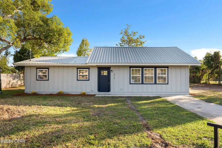 Welcome to 5118 Lake Dr, Panama City, FL! This beautifully renovated home sits on a spacious half-acre lot, offering ample outdoor space for gardening, entertaining, or relaxing. Inside, enjoy modern upgrades like brand new quartz countertops that add elegance and durability to the kitchen. The property has been fully updated with new wiring and a brand new  AC system, ensuring comfort and energy efficiency. The bathroom features a stylish, fully tiled shower for a spa-like experience. This move-in-ready gem combines fresh updates with a generous lot—perfect for those seeking space and style in a prime location!