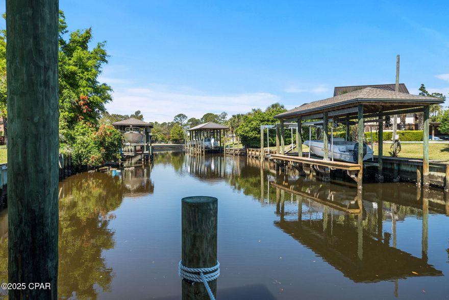 Welcome to the lifestyle you've been waiting for. 138 Queens Cir is a beautifully renovated 3-bedroom, 3.5-bathroom home in the highly sought-after King's Point neighborhood offering the rare combination of elegant living, prime location, and direct Gulf access--yes, it's boatable to the Gulf with your own private dock, boathouse, and boat lift right in the backyard. Step inside and discover a smart layout that blends functionality with comfort. The third bedroom is privately tucked away, perfect for a guest suite, home office, or multi-generational living. The second bedroom has it's own private bath and a seperate space for studying, playing or this could be another multi-generational suite.  The spacious master ensuite is a true retreat, complete with a custom walk-in closet system, a large gun safe, and a bathroom that features a farmhouse-style sink and step-in tile shower. And just when you thought it couldn't get more convenient--the attached laundry and craft room with its own sink is a game-changer for day-to-day living. This home is designed for both relaxation and entertaining. Enjoy the formal living room for cozy evenings, or head to the den with built-in bookcases to unwind or work from home in style. Enjoy engineered wood flooring throughout! The chef's kitchen is a showstopper--featuring an oversized island, a wet bar, and a separate breakfast nook that flows seamlessly into the heart of the home. Sip your morning coffee on the screened-in porch, host epic gatherings on the large outdoor patio with a brick fireplace, or wander past the mature oak tree on beautiful brick pavers to your powered workshop, covered work area, and outdoor shower. From there, it's just steps to the private dock, boathouse, and boat lift--where your next adventure begins. Whether it's fishing, cruising, or a day on the Gulf, this property brings the waterfront lifestyle right to your back door. Schedule your private tour today and see why this one checks every box.  All information should be checked if important.