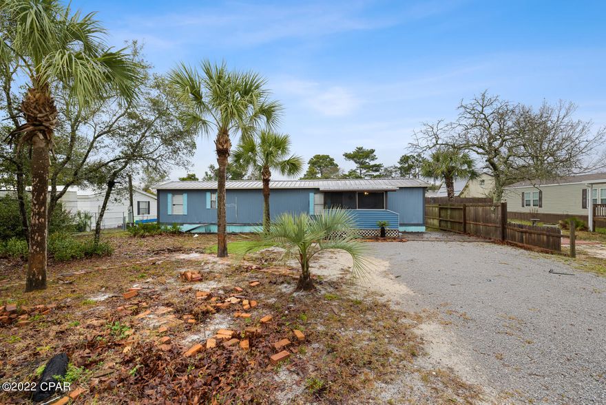 One of our new west-end favorites! This mobile home is awesome. It has a Wonderful open floor plan with a split bedroom layout.There is a large  florida room that is perfect for an additional living area ,bedroom or office.This home has upgrades such as upgraded flooring ,new kitchen cabinets & countertops &  a new HVAC. The large covered porch is ideal for extra entertaining space. This charmer sits on an oversized lot and includes a large shed.This mobile home  is nice and bright and only needs a little bit of TLC. There is plenty of room for your beach toys, boats, golf cart, and guests. This would make a fun  beach getaway. Brilliant location! Beach access is fantastic! Pier Park, the 30A corridor. & Carillon Beach just a few minutes away! Come s