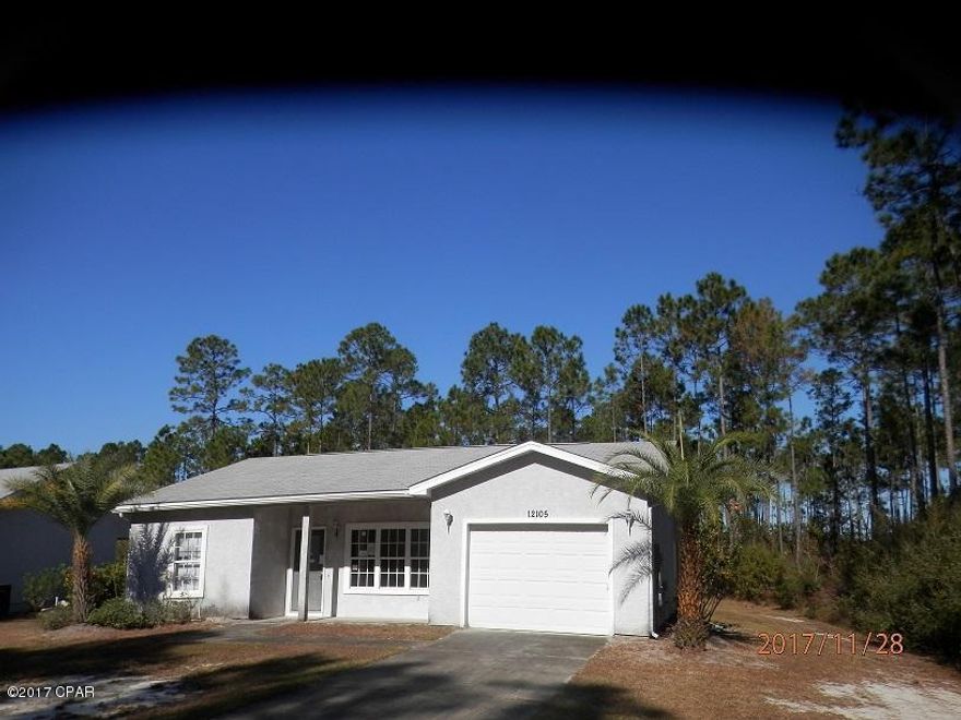 This home features split floor plan, large master bedroom with private bath with walk in closet. Secluded Community but just minutes to Tyndall. Eatin kitchen with access to the covered porch. This home does not have an AC or water heater, no carpet and will need to be a cash purchase or rehab loan purchase.