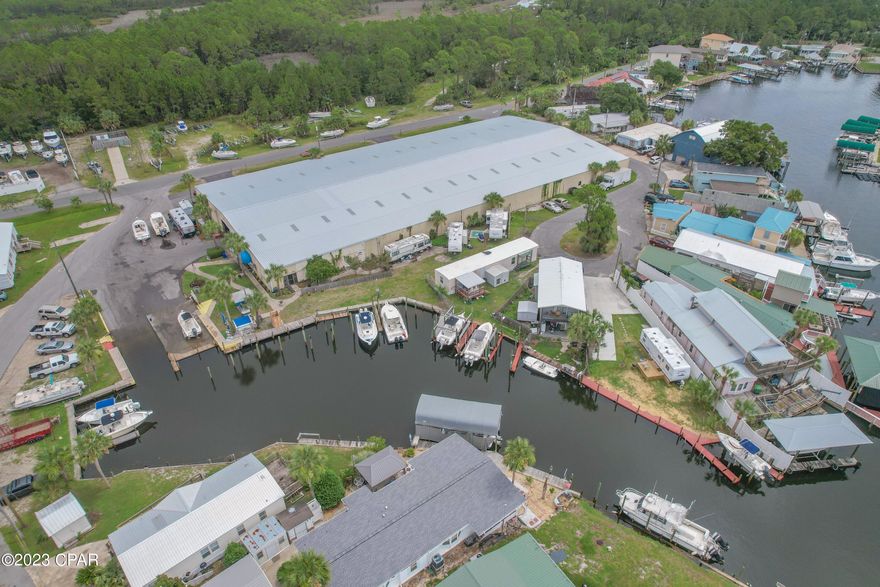 Bayside Marina is a full-service marina tucked away in the quiet corner of St Andrew Bay/Panama City Beach, and just 7 miles from the Gulf of Mexico, The Marina is in a protected deep-water Lagoon and straight access to the Gulf.  There are only 4 major marinas in the Panama City Beach area, and this is one of them and For Sale with Owner Financing if needed!  Marinas for sale are on high demand and rare to be on the market.  Marina incorporates a 45,000 square foot boat barn which can hold up to 105 boats as inside storage.  You have 240 feet of water frontage including 15 Wet Slips, and a fuel dock.  The outside dry storage across the street can hold up to 90 boats. This is a turnkey sale operation with 6 employees to include an On-Site Manager residing in the apartment.  Diversified revenue stream with sales up 23% this year. The Marina is 100% occupied and with a waiting list. There is a strong local and out of area demand for storage and service.  Seller is retiring and will entertain OWNER FINANCING WITH FLEXIBLE TERMS AND SUBSTANTIAL DOWN PAYMENT.
