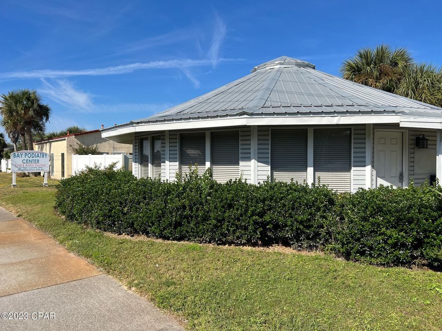 Great commercial investment location on Middle Beach Road with daily drive by traffic. Unique twin octagon buildings with high road visibility for office or business.