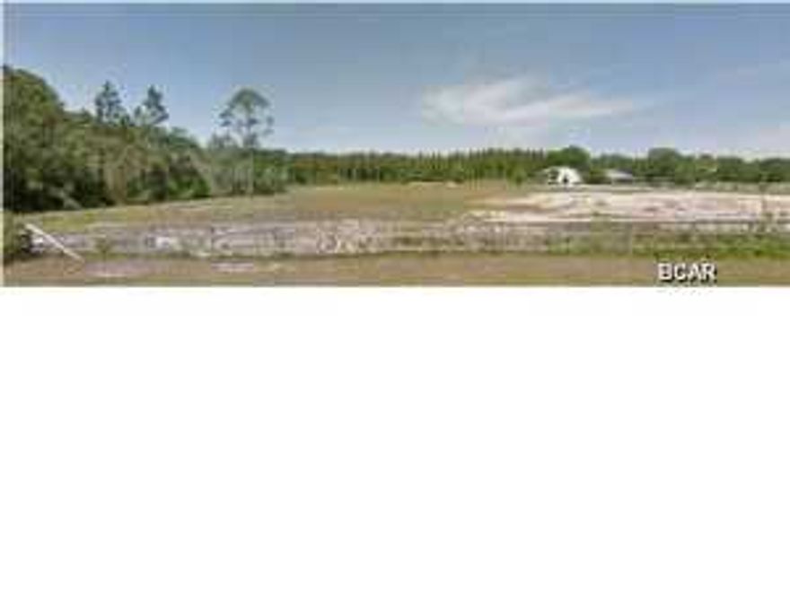 This property consists of 5 acres with a large metal building, which was previously used as a Church. A large septic system is on the property but has never been use or hooked up. Water is supplied by a well. The property is located within the Deerpoint Lake Protection Area and may possibly have it's Florida Land Use and Zoning changed to Neighborhood Commercial with clearly defined allowable uses. Changes to the Zoning and Land Use classification is not guaranteed and must go through the normal approval process.