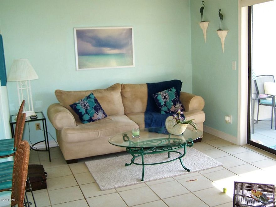 ''Endless summer paradise'' in this 2nd floor end unit with a view of the gulf from the front door! Just steps to the beach and minutes from Pier Park! Complex has 2 pools and a hot tub, as well as a community room with exercise equipment!  All measurements are approximate.