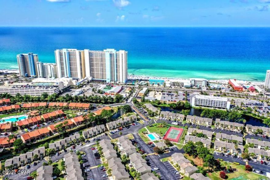 171 Robin Lane is a completely remodeled townhome in the gated resort community of Gulf Highlands on Panama City Beach with 2 bedrooms, 1.5 bathrooms.  You must view this immaculate home that has been completely furnished by a professional decorator!  Most everything in this unit is new, and has not been lived since the remodel took place, also non-vacation rental and includes hurricane shutters, new appliances, etc!   The community has 11 pools, 5 heated, tennis courts, mini-golf, exercise room, conference center with wi-fi connection. Gulf Highlands is walking distance to the Gulf of Mexico with a private clubhouse and pool right on the beach for owners and guests. Long and short term rentals allowed, low hoa fees, gated, security, private beachfront pool and clubhouse, come visit today