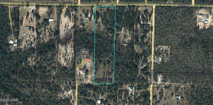 10 acres on paved road. Lot has well, septic, and shed. Unrestriced land. No deed restrictions.