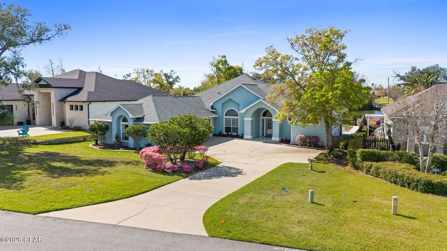 Welcome to 2407 Willow Lane in Lynn Haven, a beautiful 4-bedroom 3-bath, 3-car garage lake front home located inside the Panama Country Club golf community.  Perfectly positioned on Willow Lake and overlooking the #7 hole of the Panama Country Club golf course, this property offers peaceful water views and scenic fairway surroundings.  

Designed with a split floor plan, this home provides both privacy and functionality, making it ideal for families or those who enjoy hosting guests.  French doors open to a covered veranda overlooking the fairway and lake.  A private dock extends to Willow Lake, creating a true indoor-outdoor lifestyle.  The spacious layout features generous living areas, abundant natural light, and stunning views of the lake and golf course from multiple rooms.  Enjoy morning coffee or evening sunsets with tranquil lake and golf course views.  

Granite countertops, stainless steel appliances, and established landscaping enhance security for pets and gatherings while maximining the view.  Located in the highly desirable Panama Country Club area of Lynn Haven,  this home is just minutes from shopping, dining, parks, and the top Bay County Schools, while still offering the quiet atmosphere of a golf and waterfront community.

Golf. Water. View. Privacy.

If you're searching for a golf course home, lakefront property, or Panama Country Club real estate in Lynn Haven, this property is a must see.