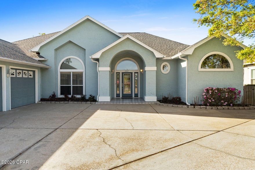 Welcome to 2407 Willow Lane in Lynn Haven, a beautiful 4-bedroom 3-bath, 3-car garage lake front home located inside the Panama Country Club golf community.  Perfectly positioned on Willow Lake and overlooking the #7 hole of the Panama Country Club golf course, this property offers peaceful water views and scenic fairway surroundings.  

Designed with a split floor plan, this home provides both privacy and functionality, making it ideal for families or those who enjoy hosting guests.  French doors open to a covered veranda overlooking the fairway and lake.  A private dock extends to Willow Lake, creating a true indoor-outdoor lifestyle.  The spacious layout features generous living areas, abundant natural light, and stunning views of the lake and golf course from multiple rooms.  Enjoy morning coffee or evening sunsets with tranquil lake and golf course views.  

Granite countertops, stainless steel appliances, and established landscaping enhance security for pets and gatherings while maximining the view.  Located in the highly desirable Panama Country Club area of Lynn Haven,  this home is just minutes from shopping, dining, parks, and the top Bay County Schools, while still offering the quiet atmosphere of a golf and waterfront community.

Golf. Water. View. Privacy.

If you're searching for a golf course home, lakefront property, or Panama Country Club real estate in Lynn Haven, this property is a must see.