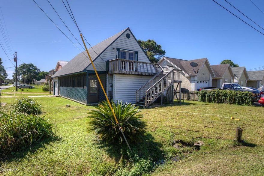 Located in the much desired East end beach area, 1 block to the Lagoon boat ramp, and walking distance to the beach.

The home features a corner lot, a 1 car garage, a carport, storage building, screened in porch, and plenty of room for a family with pets and water toys.

1 bedroom and bath downstairs, with laundry, kitchen, dining and sitting area. Upstairs has a split plan with 2 more bedrooms and bath and living room, with decks on both sides of the home.

All room sizes are approx. Measure if important. Best bargain at the beach at just $94 per Sq. Ft. ''Owner motivated''.

A lttle tlc is needed.