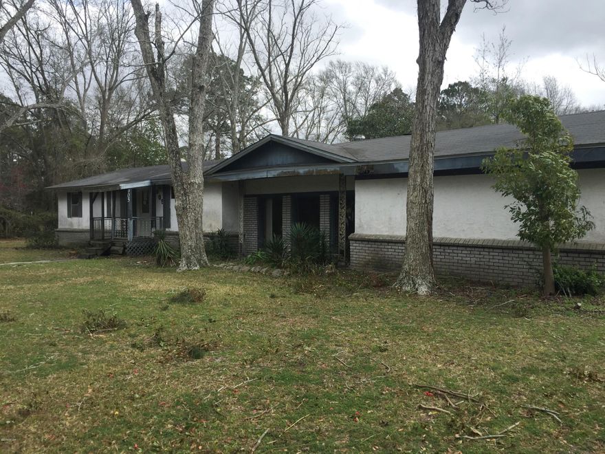 Sprawling ranch style home in Lynn Haven. Beautiful huge corner lot with mature trees mostly fenced in. This 3 bedroom, 2 bath home has a living room plus a large family room with a brick fireplace and an eat in kitchen. It also has a 2 car garage and a shed.