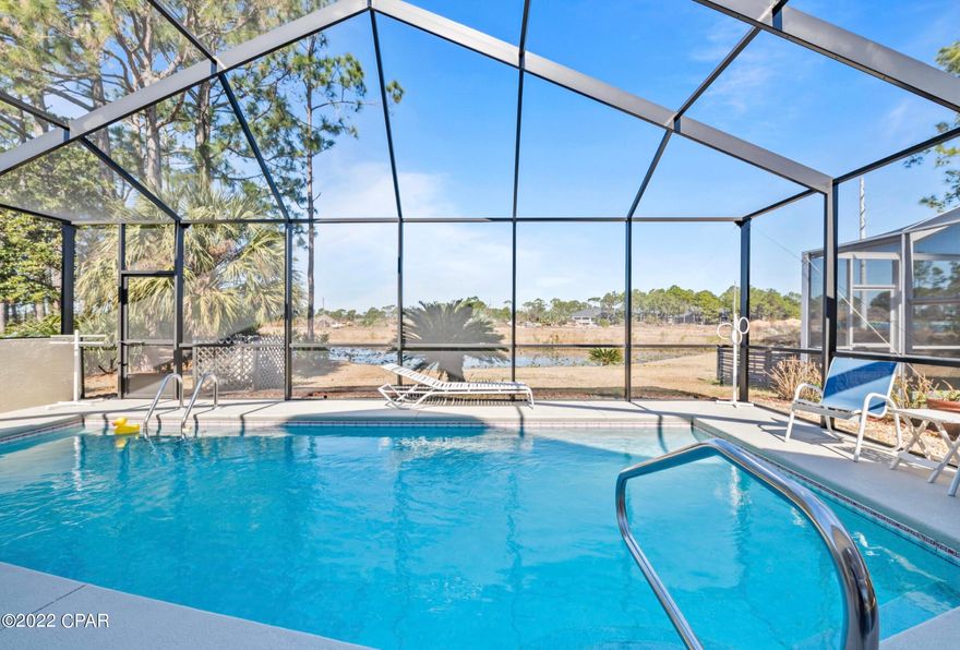 Rarely will you find a home so READY to greet a new owner; a home as IMMACULATE in condition and as INCREDIBLE in LOCATION as this in THE GLADES. Each light-filled room offers something SPECIAL...detail includes BAMBOO FLOORING, NINE foot ceilings and TRANSOM windows, CROWN MOLDING, and a comfortable POOLSIDE PATIO enclosed to accommodate the seasons. Main living includes GENEROUS greatroom, formal dining space, and kitchen with bright breakfast nook. The MASTER BEDROOM SUITE is complete with TWO CLOSETS, separate tub and shower, and space for a reading nook or office. So close to the SUGAR SHORE of AWARD WINNING BEACHES, THE GLADES is within minutes of the area's FINEST DINING, entertainment, and SHOPPING destinations.