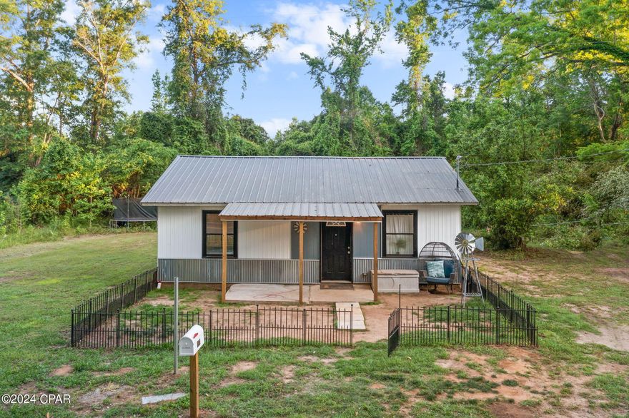 Discover the perfect blend of tranquility and convenience in this beautifully renovated home, nestled on a generous 3.49+/- acres of lush, private land. Located in a peaceful setting, this property is just 30 minutes from the bustling city of Dothan, AL, and 20 minutes from Marianna, FL, giving you the best of both worlds.

Step inside to find the entire home adorned with elegant hardwood plank floors that instantly warm up the space, creating a welcoming and cozy atmosphere that's perfect for both relaxing and entertaining. The thoughtful renovation merges modern aesthetics with comfort, making every corner of this home a delightful experience.

The renovation's thoughtful attention to detail includes practical additions too—the seller is including a washer, dryer, and refrigerator, ensuring that this home is move-in ready and equipped for your convenience.

This property does not just offer a home; it offers a private haven where the splendor of nature surrounds you. With 3.49 acres of land, your options are limitless. Whether you dream of cultivating a garden, hosting grand family picnics, or simply enjoying the peace and quiet of your expansive surroundings, this property can accommodate all your desires.

Do not miss the opportunity to own this magnificent retreat, where every day feels like a vacation. Schedule a viewing today and start the journey to making this exceptional property your new home. Experience the lifestyle you've been dreaming of—peaceful, private, and perfect.

Buyer to verify measurements; all dimensions are estimates