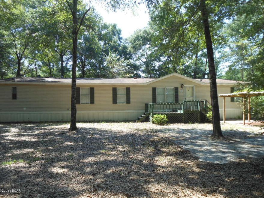 CONGRATULATIONS ! By reading this you have a unique opportunity to purchase this move in ready home, on a large, beautiful, corner lot, that's also close to Deer Point Lake !  You've finally found the affordable home of your dreams! Just wait until you pull up in the driveway and look around the wonderfully tree shaded lot. In front there is a covered and bricked area that's just perfect to relax in after a hard day of fishing in Deer Point Lake. There is a large, 20x12 storage building for all of Dad's yard and fishing toys. There's even a smaller building that would be perfect parking for a yard tractor!  We didn't forget the kids and the family dog. This huge yard has a large, fully fenced area all around the home for the kids and dog to run and play! When you enter the front door, you'll will be delighted in trying to figure out where to put you big screen tv and all your furniture in this huge 25 foot long living room !  Mom will enjoy seeing the kitchen and will instantly realize she finally has tons of cabinet and counter spaces.  The whole family will enjoy the large den featuring a wood burning fireplace for those cozy, winter nights ! The master bedroom, which by the way, is at the opposite end of the home from the kids rooms, has his and hers walking closet. Open the double doors and you will immediately see the large, master bath that has a skylight over the garden tub. Allow plenty of time to see this home and property.  There is much to see and has something for everyone in the family !!!  The home is being offered as is with the right to cancel the contract based on any home inspection that may be deemed to be unsatisfactory.