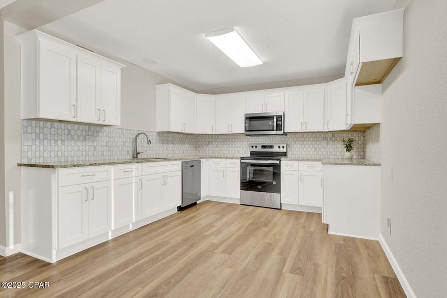 Beautifully Renovated Home on 1.3 Acres of Privacy!
Discover the perfect blend of charm and modern comfort.  Situated on a spacious 1.325-acre lot, this unique property offers exceptional privacy and room to spread out—complete with an upper balcony overlooking the serene, tree-lined yard. Inside, the home has been fully remodeled from top to bottom, featuring new LVP flooring throughout, fresh paint, and nearly all-new drywall. The kitchen and bathrooms shine with brand-new cabinets, granite countertops, and updated fixtures.

Major system upgrades include updated plumbing, electrical, ductwork, and both interior air handlers. The home also boasts all new windows, six new exterior doors, new front and rear French doors, and sliding balcony doors. A new range, microwave, and full-size laundry hookups add everyday convenience. The tankless water heater and two HVAC units—both replaced within the last three years—provide efficiency and peace of mind.

Originally featuring a large vaulted living room, the back porch now offers a spacious brick-look tiled patio perfect for relaxing or entertaining. The expansive backyard has been fully cleared and ready for your vision—ideal for gardening, outdoor activities, or adding a workshop or pool.

This one-of-a-kind property combines modern updates, privacy, and land rarely found in the city.