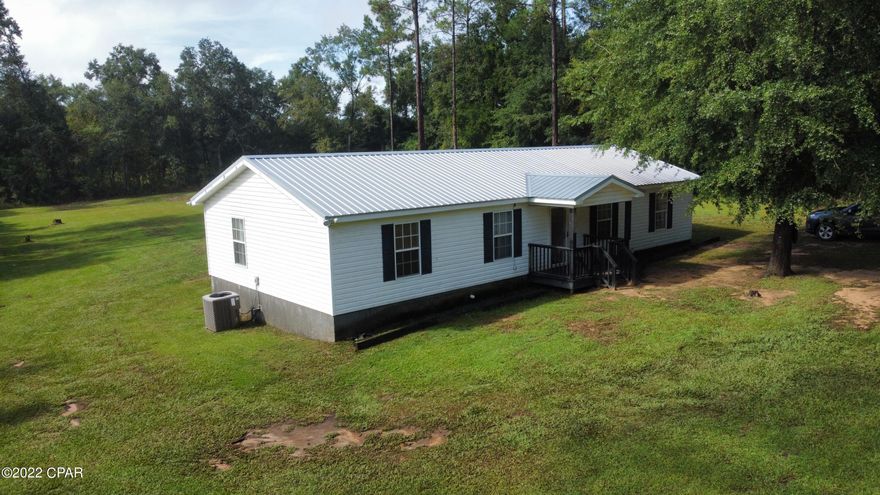 'CURRENTLY UNDER CONTRACT, SELLER WILL CONSIDER BACKUP OFFERS Welcome to  the country this custom built  4- Bedroom ranch style home is situated between Graceville and Poplar Springs.  Conveniently located at the end of the road.  It has a Graceville mailing address but is located in Holmes County.  Just a short drive to Dothan!   Huge back yard!  Very roomy home with endless possibilities!