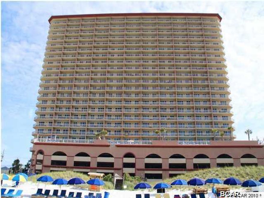 This fantastic, 1,577s.ft., 3bed/3bath condominium lives like a beach house but comes with all the benefits of owning a condo. Eastern facing corner location and perfect mid stack elevation. Recently remodeled with hard surface flooring, custom window treatments, and tile back splashes in kitchen and master bath. Property will convey with new and luxurious beach-inspired furnishings and artwork that welcome you to lie back and relax with views of the beach and ocean. New HVAC in 2015. Fully equipped kitchen features solid granite countertops. The sunset views from the 46' private wrap-around balcony are a perfect end to a sunny day and beginning to an exciting evening the ultimate in alfresco living! MAIN MASTER BEDROOM is front and center on the beach with access to the main balcony and private bath with garden tub and separate shower. The slider overlooking the gulf from the master bedroom provides magnificent views. SECOND MASTER BEDROOM is larger than most 2nd bedrooms, has gulf views, and also has it's own private bath. THIRD GUEST BEDROOM is large enough to accommodate two full-sized beds The condo also has a generous laundry room with a large-sized washer and dryer. An exterior lockable storage closet (S-052) will also convey.
Sunrise Beach Resort is one of the newest Gulf Front condominiums in Panama City Beach and has one of the best locations on Front Beach Road. 5MIN WALK TO PIER PARK! FOUR HIGH-SPEED ELEVATORS serve 221 condos which is one of the best ratio of elevator/condo on the beach. Also, PARKING IS UNDER THE BUILDING, no long walk-over every time you park, especially to this condo. Centrally located to all the dining and entertainment PCB is famous for including spas, shopping, golf, fishing and more! Sunrise Beach has amazing amenities, including: 346 feet on the Gulf of Mexico, 2 Gulf front swimming pools (one is heated), 2 Gulf front spas, children's splash pad, Gulf front exercise room, catering kitchen, private theatre room with 50 inch plasma TV, private clubhouse, covered parking in garage under the building (you don't have walk across the street), , BBQ area with gas grills and more! Sunrise Beach is owner controlled which means the homeowners own the gym, the pools, and receive the income from the Beach Chairs, etc! Rental history available upon request. * All linens and towels are property of the rental management company and do not convey.